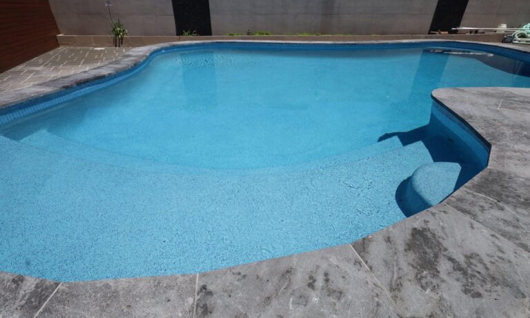 Professional swimming pool coating completed on a concrete pool in Perth with a smooth, durable blue finish