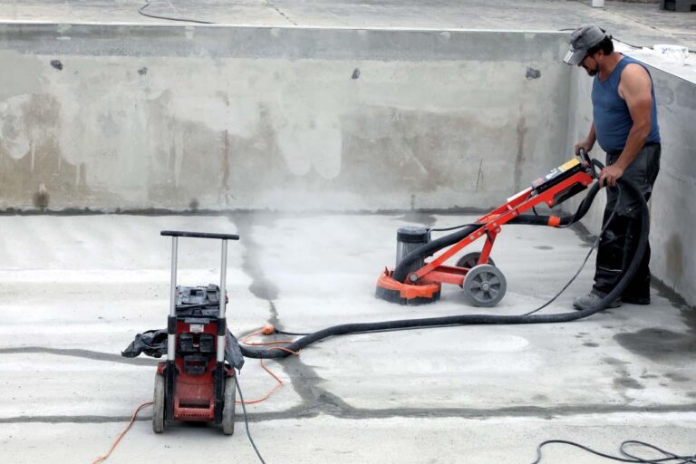 Professional surface preparation of a concrete swimming pool before coating application