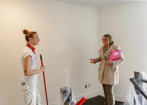 Homeowner discussing an interior painting project with a professional painter in Perth