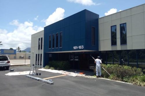 Commercial painter working on a business property in Belmont WA