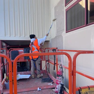 Commercial painter working on an exterior commercial property