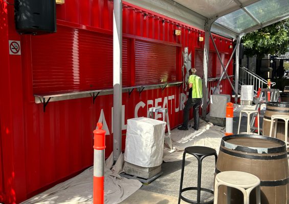 Painted shipping container used at a commercial site