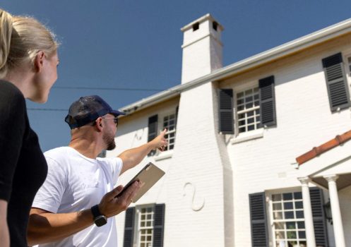 Homeowner discussing an exterior repaint with a painter in Perth