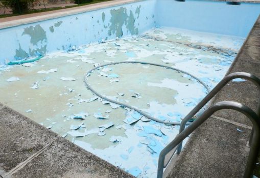 Worn and deteriorated swimming pool coating in Perth
