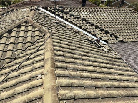 Weathered residential roof being assessed for painting in Perth